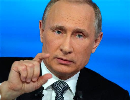 Russian President Vladimir Putin gestures as he answers for a question during his annual call-in show in Moscow, Russia, Thursday, April 14, 2016. The Kremlin has been sifting through more than 1 million questions from across the country to get Putin ready for the television marathon. (Mikhail Klimentyev/Sputnik, Kremlin Pool Photo via AP)