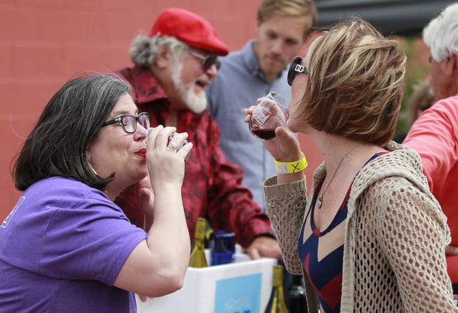 From left, Sarah Sypert talks with Becca Goicoechea while sipping wing. The Lubbock Chamber of Commerce held their 1st Annual Uncorked Wine Festival at the Louise Hopkins Center for the Arts, Friday Apr 15, 2016, in Lubbock, Texas. (Mark Rogers/AJ Media)