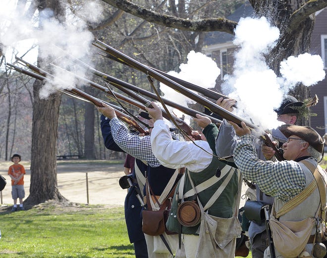 The Colonial militia gather for a salute during a previous Patriots' Day celebration at Old Sturbridge Village. T&G File Photo/Jim Collins