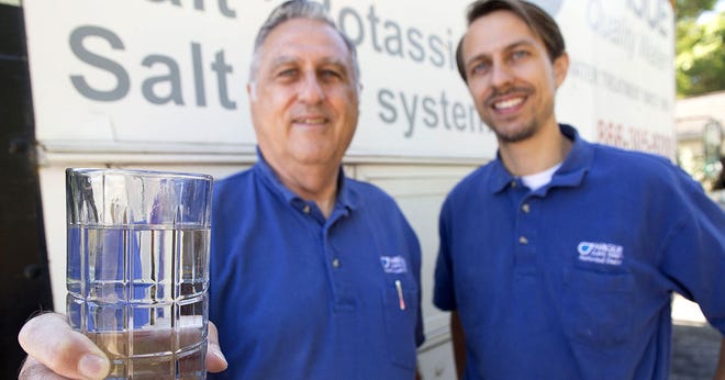 Don Bragdon, left, and his son, Barry, of Hague Quality Water, are teaming up to teach people the importance of pure water by offering free water testing. CINDY DIAN / CORRESPONDENT