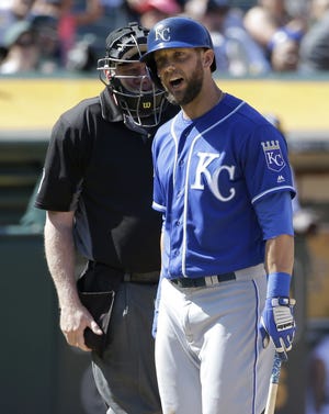 Royals left fielder Alex Gordon argues with home plate umpire Quinn Wolcott after being called out on strikes during the ninth inning.