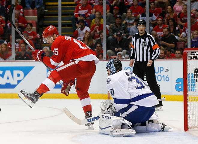 Detroit Red Wings center Riley Sheahan (15) moves for a shot while screening Tampa Bay Lightning goalie Ben Bishop (30) in the second period of Game 3 in a first-round NHL hockey Stanley Cup playoff series, Sunday, April 17, 2016, in Detroit.