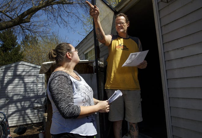 Jack Martin points to the area where he remembers Rachel Barrish living years ago as he talks with Barrish's aunt Amber Presser who was out looking for the missing Taylorville teen Sunday, April 17, 2016. Ted Schurter/The State Journal-Register