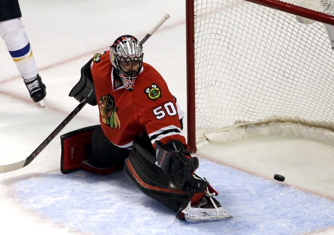 Chicago's Corey Crawford cannot make the stop on a goal by St. Louis's Jaden Schwartz during the third period. The Associated Press