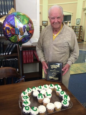 M.L. Weaver, 91, was recently presented with a 2016 Volunteer of the Year award at the Massillon Public Library. He has donated more than 3,000 hours of service. (Provided Photo)