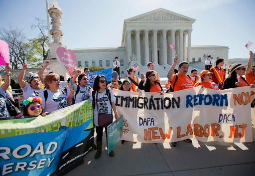 Supporters of fair immigration reform gather in front of the Supreme Court in Washington on Monday, April 18, 2016. The Supreme Court is taking up an important dispute over immigration that could affect millions of people who are living in the country illegally.