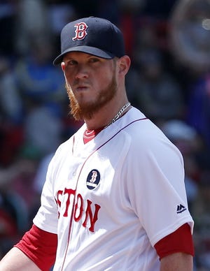 Red Sox closer Craig Kimbrel heads to the dugout after allowing three inherited runners to score during the eighth inning of Boston's 4-3 loss to the Blue Jays on Monday.