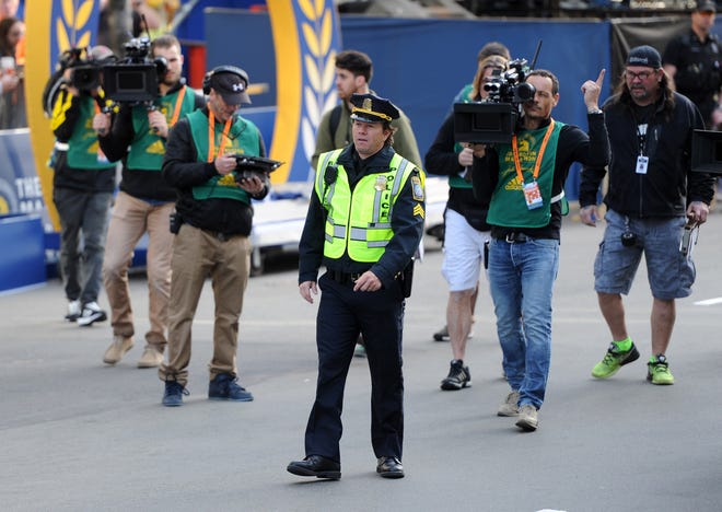 Actor Mark Wahlberg filming his movie 'Patriot's Day at Boston Marathon finish line on Monday, April 18, 2016.

(Marc Vasconcellos/The Enterprise)