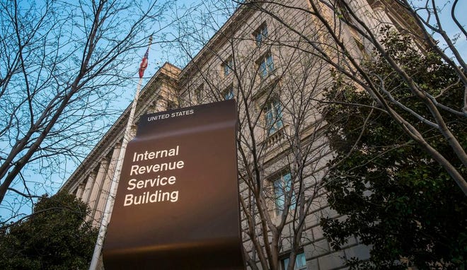 This April 13, 2014, file photo shows the Internal Revenue Service (IRS) headquarters building in Washington. Millions of taxpayers face a midnight deadline Monday, March 18, 2016, to file their tax returns, while millions of other Americans seek more time, a six-month extension. The filing deadline was delayed three days beyond the traditional April 15 deadline, because Friday was a legal holiday in the District of Columbia. (AP Photo/J. David Ake, File)