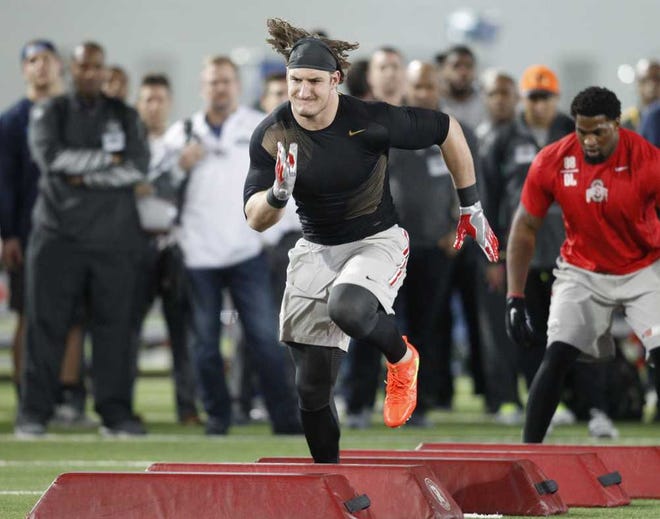 Ohio State defensive lineman Joey Bosa runs a drill during NFL Pro Day at Ohio State University in Columbus, Ohio, Friday, March 11, 2016 (AP Photo/Paul Vernon)