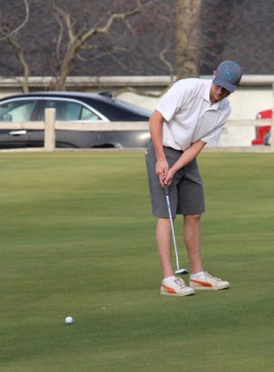 Hillsdale Academy's Logan Tharp putts during the first SCAAgolfing jamboree of spring. MATTHEW LOUNSBERRY PHOTO