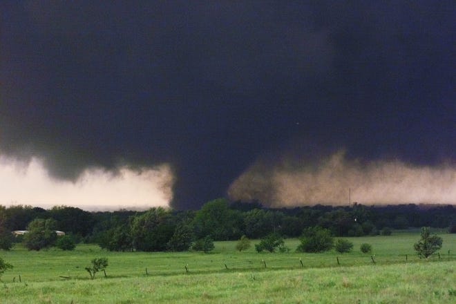 May 3, 1999, Oklahoma City Tornado: The tornado which swept across SW OKC and Moore as seen at about May Ave. and SW 134th around 7:30 PM. By Paul Hellstern, The Oklahoman.