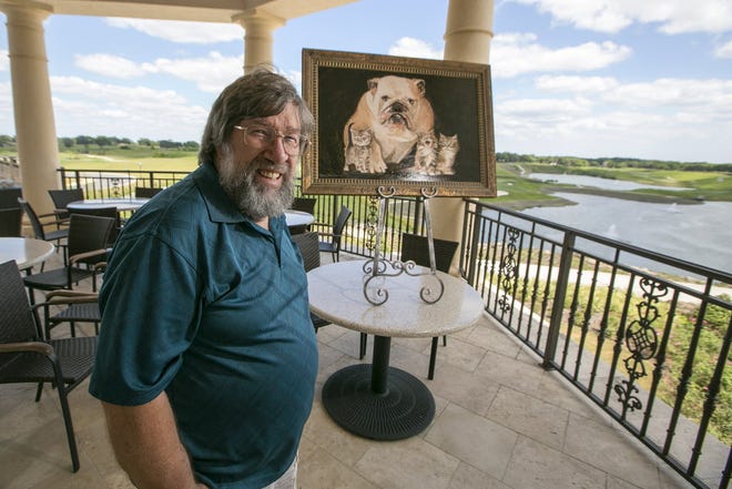Artist Robert Stebleton poses with his painting that is the signature piece for the upcoming Humane Society fundraiser at Adena Golf and Country Club this Friday.