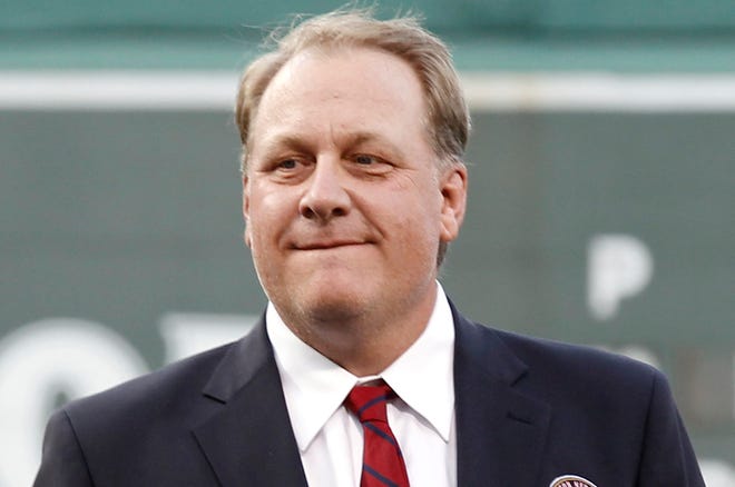 FILE - In this Aug. 3, 2012, file photo, former Boston Red Sox pitcher Curt Schilling looks on after being introduced as a new member of the Boston Red Sox Hall of Fame before a baseball game between the Red Sox and the Minnesota Twins at Fenway Park in Boston. Schilling is defending himself after making comments on social media about transgender people, saying he was expressing his opinion. (AP Photo/Winslow Townson, File)