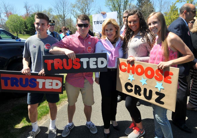 Shawnee High School students Caleb Longshaw, 17, Chase Hiller, 17, Lauren Smith, 17, and Ellie Longshaw, 16, pose for a photo with Heidi Cruz as she campaigns for her husband, Texas Sen. Ted Cruz, at Freedom Park in Medford on Wednesday, April 20, 2016.