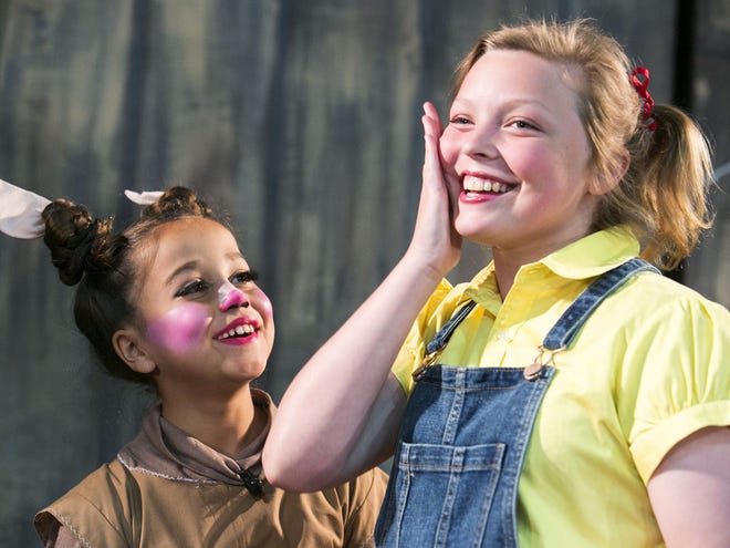 EVENT SPOTLIGHT: Sophia Tieche, left, plays Wilbur the pig and Blaine Baxley plays Fern in "Charlotte's Web," opening this weekend St. John Lutheran School.
