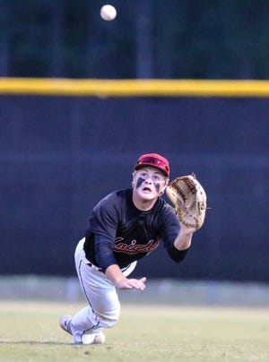 GARY McCULLOUGH/CORRESPONDENT Creekside's Josh Schneider catches a Nease fly ball hit to right field in the District 4-7A championship on Wednesday at Creekside High School.