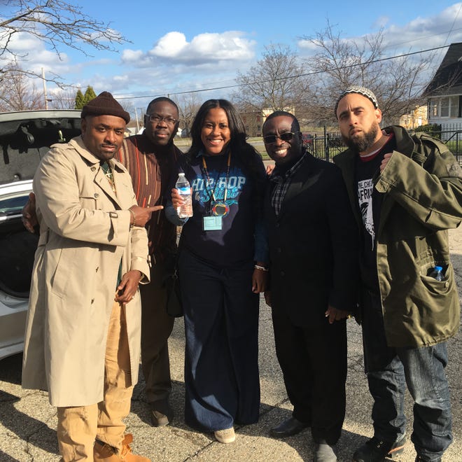 Spoken-word artist and activist Erik Andrade, far right, joined other artists April 9 in Flint, Michigan for a benefit concert and filter giveaway. COURTESY PHOTO