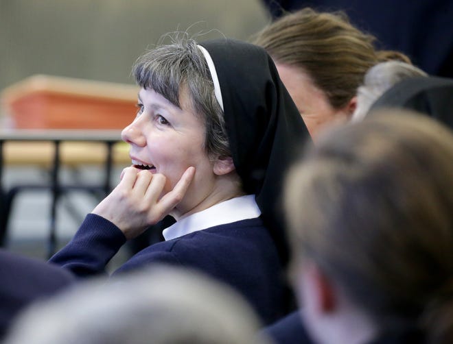 In a Wednesday, April 13, 2016 file photo, Sister Kimberly Miller, a Philadelphia nun and teacher at Little Flower High School for Girls in the city, looks on before appearing in Washington Township Municipal Court, in Washington Township, N.J. Miller was convicted Wednesday, April 20, 2016, of drunken driving charges despite her assertion that she had a sedative and doesn't remember crashing her car into a New Jersey building. (Tim Hawk/NJ.com via AP, Pool, File)