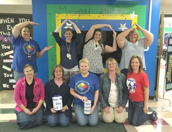 The staff at Greenfield School participated in Wear Blue Day, with proceeds going towards CAPA. COURTESY PHOTO