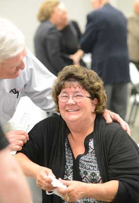 Donna Patton is overcome with emotion Tuesday after she and her late husband, Jim, were announced La Grange Chamber of Commerce’s Citizens of the Year.