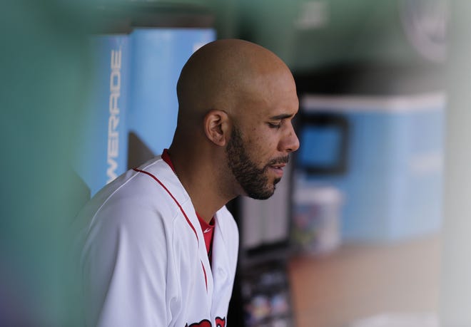 Red Sox starting pitcher David Price sits in the dugout after being pulled during the fourth inning of Boston's 12-8 loss to the Rays on Thursday afternoon. Price gave up six runs in the fourth.