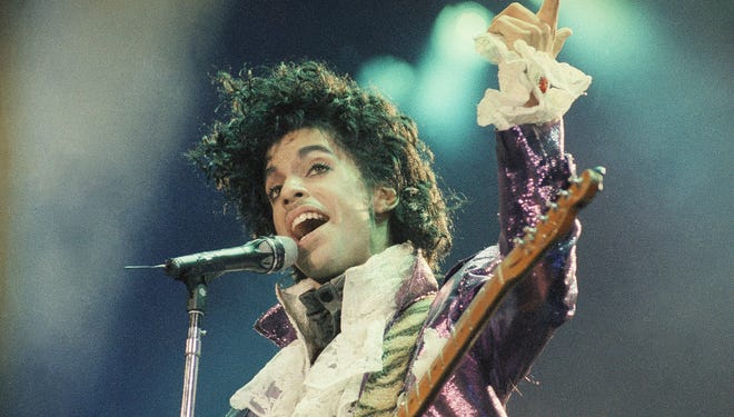 Rock singer Prince performs at the Forum in Inglewood, Calif., during his opening show, Feb. 18, 1985. (AP Photo/Liu Heung Shing)