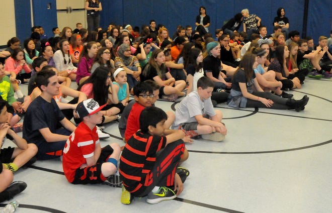 Seventh-graders at Frances S. DeMasi Middle School in Evesham listen to Moustafa Aldouri, an Iraqi refugee, Friday, April 22, 2016.