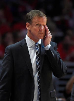 Portland Trail Blazers coach Terry Stotts wipes his face during the first half in Game 2 of the team's first-round NBA basketball playoff series against the Los Angeles Clippers, Wednesday, April 20, 2016, in Los Angeles. (AP Photo/Mark J. Terrill)