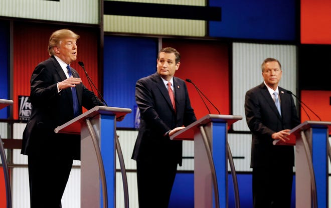 In this March 3, 2016 file photo, Republican presidential candidates, businessman Donald Trump, Sen. Ted Cruz, R-Texas, and Ohio Gov. John Kasich appear during a Republican presidential primary debate at the Fox Theatre in Detroit. Michigan Republicans meet Saturday, April 9, in Lansing for their annual convention with one of the main agenda items the choosing of delegates to the partyís presidential convention in July in Cleveland. AP Photo/Paul Sancya