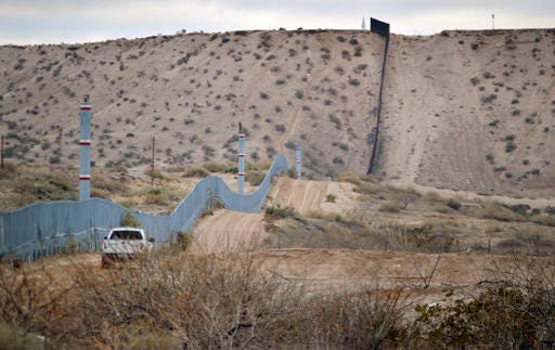 A U.S. Border Patrol agent drives near the U.S.-Mexico border fence in Sunland Park, New Mexico, on Jan. 4, 2016. U.S. Department of Homeland Security Secretary Jeh Johnson has rejected a new proposal of color-coded alerts to measure border security after a consultant called the system simplistic and misleading.