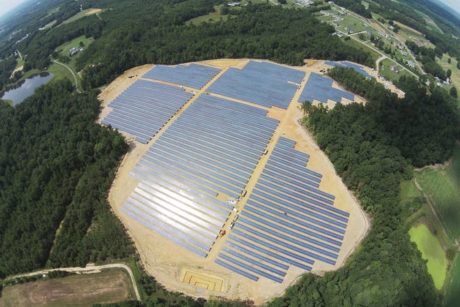 This Sept. 30 aerial photo provided by Cypress Creek Renewables shows a commercial solar farm built on farmland by Cypress Creek Renewables in Catawba County, N.C. Less than a year after New York banned fracking, dashing the hopes of farmers who had hoped to reap royalties from natural gas leases, the commercial solar industry is courting landowners for energy production. New York Gov. Andrew Cuomo's administration's initiatives aimed at promoting local renewable energy generation, reducing greenhouse gas emissions, and generating 50 percent of the state's energy from renewable sources by 2030 are bringing solar developers to the state like Cypress Creek Renewable. (Cypress Creek Renewables via AP)