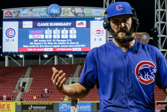 Chicago Cubs starting pitcher Jake Arrieta (49) is interviewed on television after throwing a no-hitter against the Cincinnati Reds in a baseball game, Thursday, April 21, 2016, in Cincinnati. The Cubs won 16-0. (AP Photo/John Minchillo)