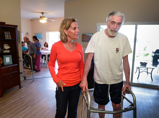 Ed Greelegs and his wife, Susan Holik, at the Lily's Promise residence in Sarasota. Greelegs received a diagnosis of early-onset Parkinson's disease at 50. Now 65, he gets personalized care at this six-person home.