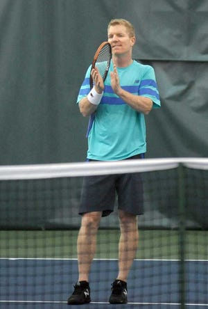 Sean Steffen / Amarillo Globe-News Jim Courier who is the current captain of the U.S. Davis Cup team applauds a shot made against him by Alex O'Brien Sunday, April 24, 2016 during an exhibition at the Amarillo Country Club. The charity event was part of the Alex O'Brien Tennis Foundation.