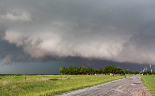 FILE - In this May 31, 2013 file photo, a tornado forms near Banner Road and Praire Circle in El Reno, Okla. Forecasters are finding that the human mind is more difficult to predict than a stormy atmosphere. As the nation’s midsection braces for bad weather Tuesday, April 26, 2016, researchers are still trying to determine when to raise a general alarm with the public, so warnings will be more effective. The National Weather Service has even brought on a social scientist to help. (AP Photo/Alonzo Adams, File)