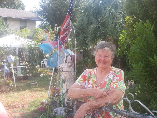 Jo-Ellen Gorris, 74, stands in front of her home in the Village of the Arts section of Bradenton. She has owned the home since 1999, where she sells the clay statues she makes. She knows virtually everyone in the eccentric, tight-knit community.