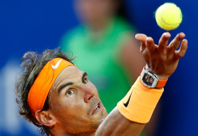 Spain's Rafael Nadal launches a ball to returning it to Japan’s Kei Nishikori during the Barcelona Open tennis tournament final in Barcelona, Spain, Sunday, April 24, 2016.