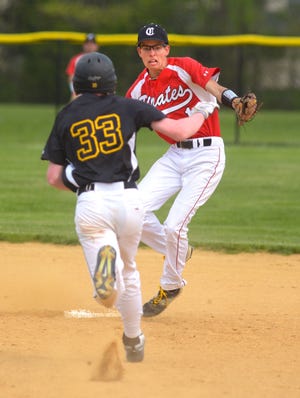 Moorestown’s Chris Baker heads to second with a double as Cinnaminson shortstop Mike Graff covers during a game Monday, April 25, 2016.