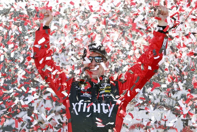 Carl Edwards celebrates after winning the Sprint Cup auto race at Richmond International Raceway in Richmond, Va., Sunday, April 24, 2016. (AP Photo/Chet Strange)