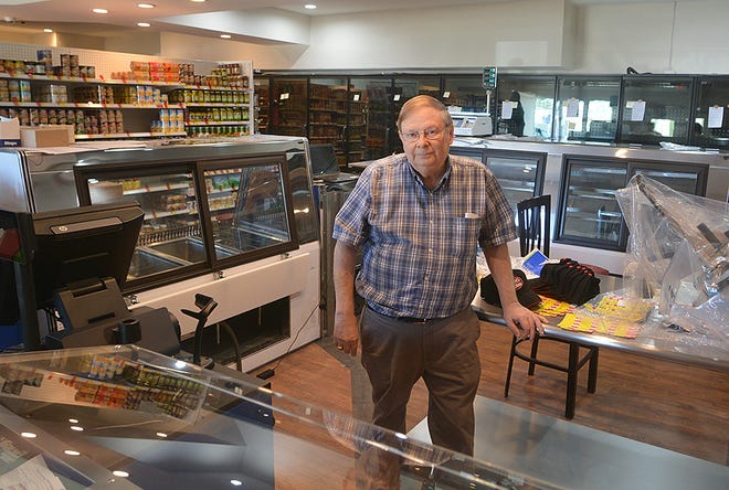 Owner Lee Webb stands behind the counter of the new Addison Shurfine Market on Front Street in Addison. The market will have a soft opening on May 2.