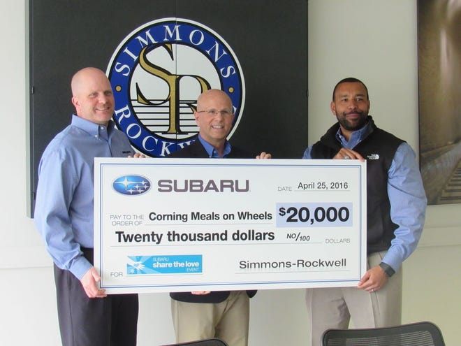 Corning Meals on Wheels Executive Director David Smith (middle) is presented a $20,000 check from Subaru for Meals on Wheels alongside Simmons Rockwell General Manager James Felker (left) and Sales Manager Billy Keels (right).
