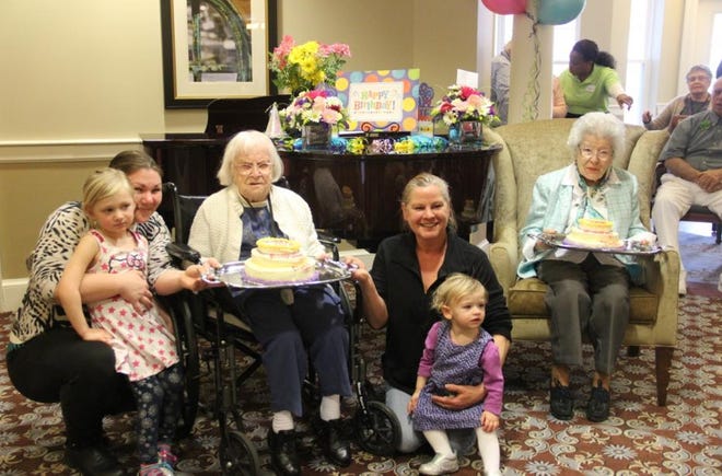 Delphine "Del" Boudria (third from left) and Marie "Toni" Boyd (right) celebrate their birthdays with family, friends and cakes at The Residence at Cedar Dell. PHIL DEVITT/FALL RIVER SPIRIT/SCMG