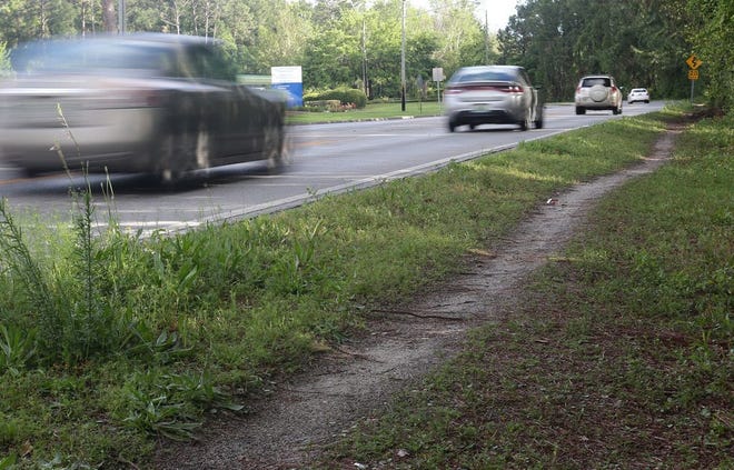 A dirt path along State Avenue leading to Wal-Mart is among the stretches Panama City officials hope to turn into paved sidewalk. The city has applied for a grant to pave the portion from 19th Street to 23rd Street in Panama City.