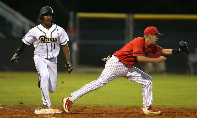 Rutherford’s Jacquez Koonce injured his hamstring on this play on Thursday as Bay first baseman Austin Summerbell stretches for the putout.