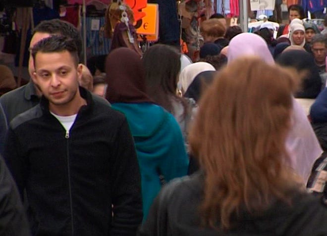 FILE - This Wednesday April 13, 2016 file image taken from video of of Salah Abdeslam, left, the fugitive from the Nov. 13 Paris attacks whose capture appears to have precipitated the March 22 bombing in Brussels. Belgian prosecutors confirmed Wednesday April 27, 2016 that Paris attacks suspect Salah Abdeslam was handed over to French authorities. (TVbrussels via AP)