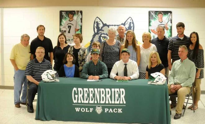 Surrounded by family members, Greenbrier's Nick Reid and Caleb Culverhouse signed scholarships to continue to play lacrosse together at Lees-McRae College.