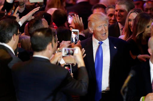 Republican presidential candidate Donald Trump makes his way along a line of supporters before speaking during a primary night news conference on Tuesday, April 26, 2016, in New York.