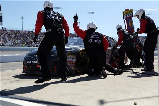 Carl Edwards comes in for a pit stop during the Sprint Cup auto race at Richmond International Raceway in Richmond, Va., Sunday, April 24, 2016. (AP Photo/Chet Strange)