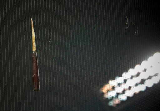 Philadelphia Phillies Cesar Hernandez's broken bat hangs from netting behind home plate in the seventh inning of a baseball game against the Washington Nationals, Wednesday, April 27, 2016 in Washington. (AP Photo/Pablo Martinez Monsivais)